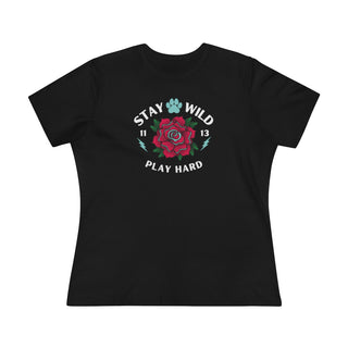 Stay Wild Women's Premium Tee in Black. Shown is front of Stay Wild Design features a tattoo style rose with the phrase "Stay Wild, Play Hard" around it. The back of shirt features the Stay Wild Benefit Beagle Logo Design.