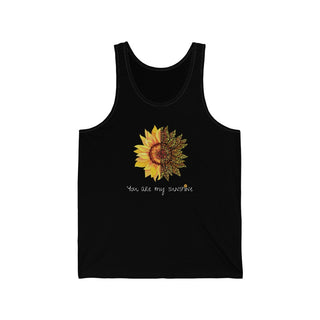 You are my Sunshine Unisex Jersey Tank in Black. Shown is the front showcasing a sunflower which is split down the middle and half is made out of paw prints. Underneath is the phrase "You are my Sunshine" . Back of shirt features the Sunflower Benefit Beagle Logo.
