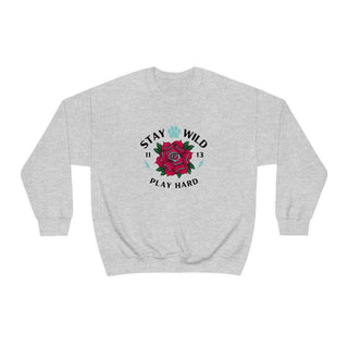 Stay Wild Unisex Heavy Blend Crewneck Sweatshirt in Ash. The Stay Wild Design features a tattoo style rose with the phrase "Stay Wild, Play Hard" around it. The back of shirt features the Stay Wild Benefit Beagle Logo Design.