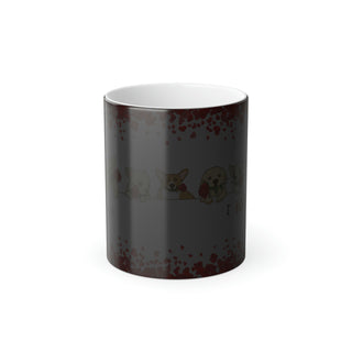 Color morphing mug with dogs holding roses in their mouths and the saying "I woof you too". Mug is dark due to lack of hot beverage. It will morph to white with design when containing hot beverage.
