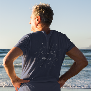 Live in the Moment Unisex Short Sleeve Tee in Navy. The Live in the Moment design features a graphic on the back with the phrase "Live in the Moment" surrounded by shooting stars.