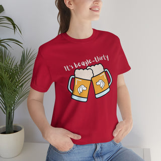 Beagle-Thirty Mugs Unisex Jersey Short Sleeve Tee in Red. The front of shirt showcases  Two Dog Adored Mugs clinking with the saying, "It's Beagle-Thirty" above it. Back of shirt features a corresponding Benefit Beagle Logo.