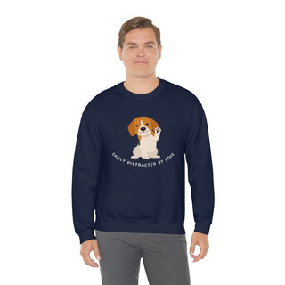 Easily Distracted Unisex Heavy Blend Crewneck Sweatshirt in Navy. Shown is front design featuring a dog waving with the saying "Easily Distracted by Dogs" below it. The back of shirt has the classic Benefit Beagle Logo.