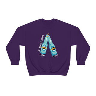 Beagle-Thirty Bottles Unisex Heavy Blend Crewneck Sweatshirt in Purple. The front of shirt showcases Two Paw Labeled Bottles clinking with the saying, "It's Beagle-Thirty". Back of shirt features corresponding Benefit Beagle Logo.