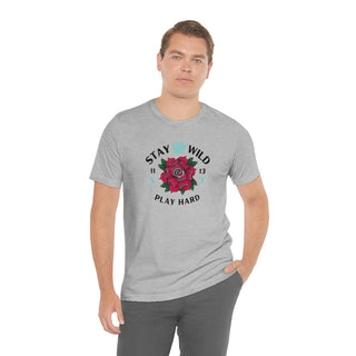 Stay Wild Unisex Premium Tee in Athletic Heather. Shown is front of Stay Wild Design features a tattoo style rose with the phrase "Stay Wild, Play Hard" around it. The back of shirt features the Stay Wild Benefit Beagle Logo Design.