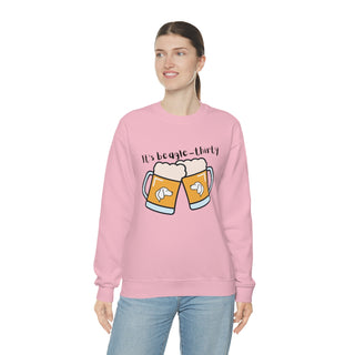 Beagle-Thirty Mugs Unisex Heavy Blend Crewneck Sweatshirt in Light Pink. The front of shirt showcases Two Dog Adorned Mugs clinking with the saying, "It's Beagle-Thirty" above it. Back of shirt features corresponding Benefit Beagle Logo.