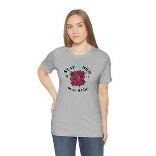 Stay Wild Unisex Premium Tee in Athletic Heather. Shown is front of Stay Wild Design features a tattoo style rose with the phrase "Stay Wild, Play Hard" around it. The back of shirt features the Stay Wild Benefit Beagle Logo Design.