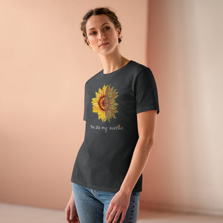 You are my Sunshine Women's Premium Tee shirt in Asphalt. Shown is the front showcasing a sunflower which is split down the middle and half is made out of paw prints. Underneath is the phrase "You are my Sunshine" . Back of shirt features the Sunflower Benefit Beagle Logo.