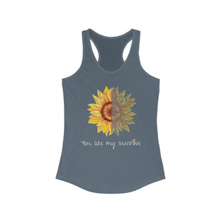 You are my Sunshine Women's Racerback Tank in Indigo. Shown is the front showcasing a sunflower which is split down the middle and half is made out of paw prints. Underneath is the phrase "You are my Sunshine" . Back of shirt features the Sunflower Benefit Beagle Logo.