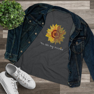 You are my Sunshine Women's Premium Tee shirt in Asphalt. Shown is the front showcasing a sunflower which is split down the middle and half is made out of paw prints. Underneath is the phrase "You are my Sunshine" . Back of shirt features the Sunflower Benefit Beagle Logo.