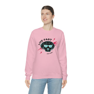 Play Hard Unisex Heavy Blend Crewneck Sweatshirt in Pink. The design features a cool dog with sunglasses and lightening bolts around it. The phrase "Live Fast, Play Hard" is around the design.