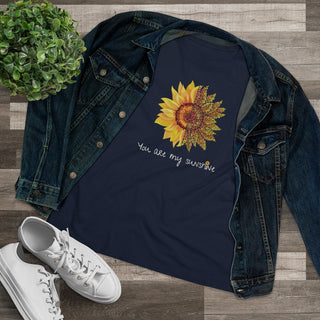 You are my Sunshine Women's Premium Tee shirt in Navy. Shown is the front showcasing a sunflower which is split down the middle and half is made out of paw prints. Underneath is the phrase "You are my Sunshine" . Back of shirt features the Sunflower Benefit Beagle Logo.