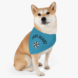 Dog wearing the Brightest Star Pet Bandana Collar in blue. The Brightest Star design features the phrase "Shine Bright" with a nautical star. Comes with adjustable black collar.