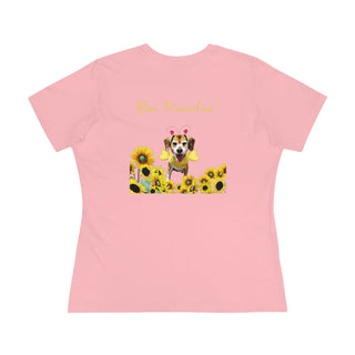 Bee Pawsitive Women's Premium Tee in Pink. Shown is back of shirt showcasing a dog dressed as as bee in a a field of sunflowers with the phrase "Bee Pawsitive!" above it. The front features the Bee Pawsitive Benefit Beagle Logo.