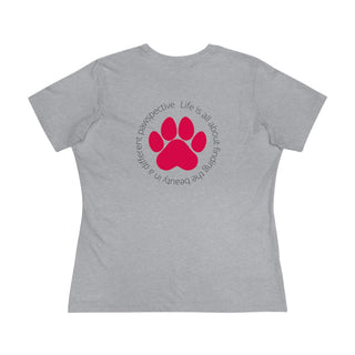 Different Pawspective Women's Premium Tee in Athletic Heather. Shown is the back of shirt featuring a large colorful pawprint with the the phrase "Life is all about finding the beauty in a different pawspective" circled around it. The Benefit Beagle Logo is located in the top corner on the front of shirt.