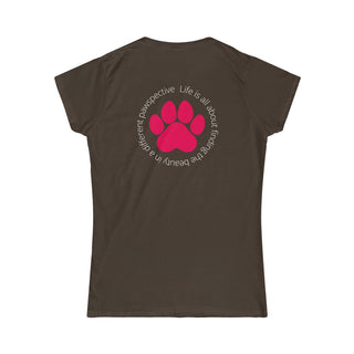 Different Pawspective Women's Softstyle Tee in Dark Chocolate. Shown is the back of shirt featuring a large colorful pawprint with the the phrase "Life is all about finding the beauty in a different pawspective" circled around it. The Benefit Beagle Logo is located in the top corner on the front of shirt.