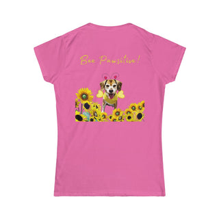 Bee Pawsitive Women's Softstyle Tee in Azalea. Shown is back of shirt showcasing a dog dressed as as bee in a a field of sunflowers with the phrase "Bee Pawsitive!" above it. The front features the Bee Pawsitive Benefit Beagle Logo.