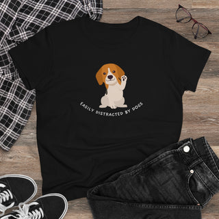 Easily Distracted Women's Midweight Cotton Tee in Team Black. Shown is front design featuring a dog waving with the saying "Easily Distracted by Dogs" below it. The back of shirt has the classic Benefit Beagle Logo.