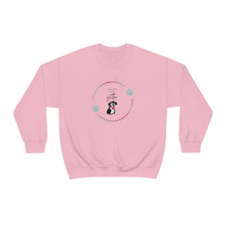 Dog Hair is my Glitter Unisex Crewneck in Light Pink. The Dog Hair is my Glitter design features a dog with the phrase "Dog Hair is my Glitter" above it and it is surrounded by a circle with paw prints.