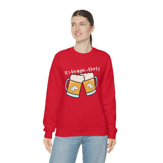 Beagle-Thirty Mugs Unisex Heavy Blend Crewneck Sweatshirt in Red. The front of shirt showcases Two Dog Adorned Mugs clinking with the saying, "It's Beagle-Thirty" above it. Back of shirt features corresponding Benefit Beagle Logo.