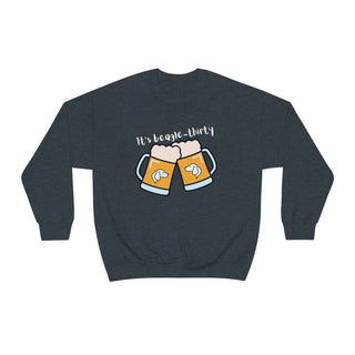 Beagle-Thirty Mugs Unisex Heavy Blend Crewneck Sweatshirt in Dark Heather. The front of shirt showcases Two Dog Adorned Mugs clinking with the saying, "It's Beagle-Thirty" above it. Back of shirt features corresponding Benefit Beagle Logo.