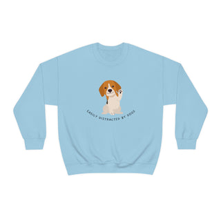 Easily Distracted Unisex Heavy Blend Crewneck Sweatshirt in Light Blue. Shown is front design featuring a dog waving with the saying "Easily Distracted by Dogs" below it. The back of shirt has the classic Benefit Beagle Logo.