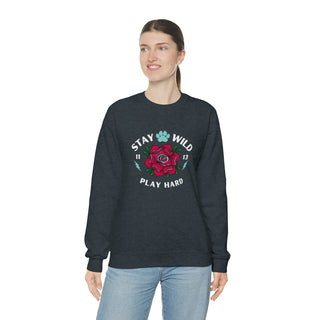 Stay Wild Unisex Heavy Blend Crewneck Sweatshirt in Dark Grey Heather. The Stay Wild Design features a tattoo style rose with the phrase "Stay Wild, Play Hard" around it. The back of shirt features the Stay Wild Benefit Beagle Logo Design.