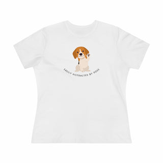 Easily Distracted Women's Premium Tee in  White. Shown is front design featuring a dog waving with the saying "Easily Distracted by Dogs" below it. The back of shirt has the classic Benefit Beagle Logo.