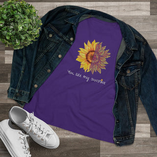 You are my Sunshine Women's Premium Tee shirt in Purple. Shown is the front showcasing a sunflower which is split down the middle and half is made out of paw prints. Underneath is the phrase "You are my Sunshine" . Back of shirt features the Sunflower Benefit Beagle Logo.