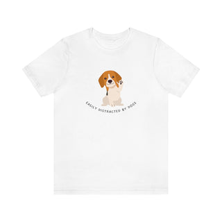 Easily Distracted Unisex Jersey Short Sleeve Tee in White. Shown is front design featuring a dog waving with the saying "Easily Distracted by Dogs" below it. The back of shirt has the classic Benefit Beagle Logo.