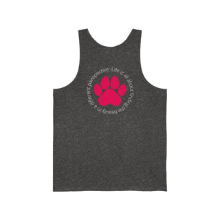 Different Pawspectives Unisex Jersey Tank in Charcoal Black Triblend. Shown is the back of shirt featuring a large colorful pawprint with the the phrase "Life is all about finding the beauty in a different pawspective" circled around it. The Benefit Beagle Logo is located in the top corner on the front of shirt.