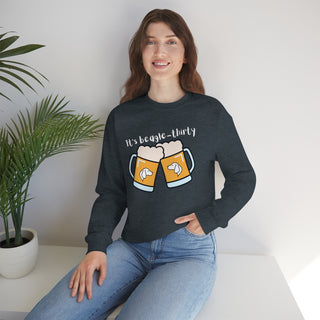 Beagle-Thirty Mugs Unisex Heavy Blend Crewneck Sweatshirt in Dark Heather. The front of shirt showcases Two Dog Adorned Mugs clinking with the saying, "It's Beagle-Thirty" above it. Back of shirt features corresponding Benefit Beagle Logo.