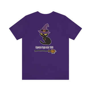 Witchy Cat Unisex Jersey Short Sleeve Tee. Back side shown in Team Purple with Wide Eyed Cartoon Cat wearing Purple Hat Standing over Broom. "Crossing Paths Since 1692". On the front of shirt is similar Witchy Benefit Beagle Logo. Purrfect for Halloween, or anytime!