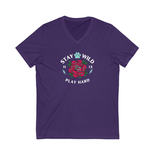 Stay Wild Unisex Jersey Short Sleeve V-Neck Tee in Team Purple. The Stay Wild Design features a tattoo style rose with the phrase "Stay Wild, Play Hard" around it. The back of shirt features the Stay Wild Benefit Beagle Logo Design.