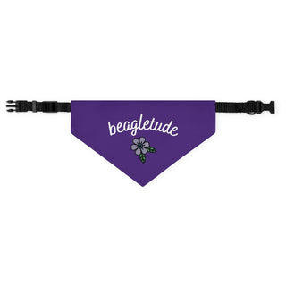 The Signature Tattoo Flower Dog Collar Bandana in Purple. The Signature Tattoo Flower design features the word "beagletude" with a tattoo style flower under it. Comes with adjustable black collar.