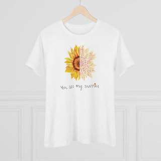 You are my Sunshine Women's Premium Tee shirt in White. Shown is the front showcasing a sunflower which is split down the middle and half is made out of paw prints. Underneath is the phrase "You are my Sunshine" . Back of shirt features the Sunflower Benefit Beagle Logo.