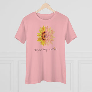 You are my Sunshine Women's Premium Tee shirt in Pink. Shown is the front showcasing a sunflower which is split down the middle and half is made out of paw prints. Underneath is the phrase "You are my Sunshine" . Back of shirt features the Sunflower Benefit Beagle Logo.