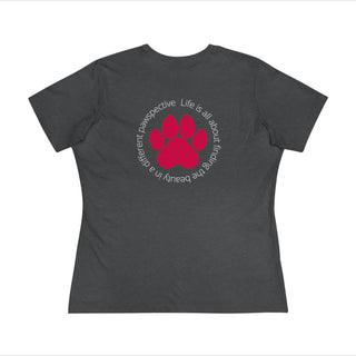 Different Pawspective Women's Premium Tee in Asphalt. Shown is the back of shirt featuring a large colorful pawprint with the the phrase "Life is all about finding the beauty in a different pawspective" circled around it. The Benefit Beagle Logo is located in the top corner on the front of shirt.