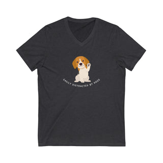 Easily Distracted Unisex Jersey Short Sleeve V-Neck Tee in Grey Heather. Shown is front design featuring a dog waving with the saying "Easily Distracted by Dogs" below it. The back of shirt has the classic Benefit Beagle Logo.