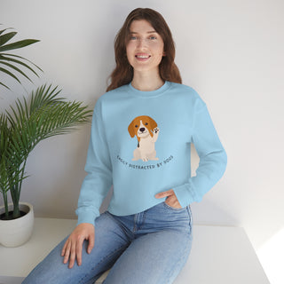 Easily Distracted Unisex Heavy Blend Crewneck Sweatshirt in Light Blue. Shown is front design featuring a dog waving with the saying "Easily Distracted by Dogs" below it. The back of shirt has the classic Benefit Beagle Logo.