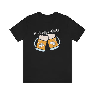 Beagle-Thirty Mugs Unisex Jersey Short Sleeve Tee in Black. The front of shirt showcases Two Dog Adorned Mugs clinking with the saying, "It's Beagle-Thirty" above it. Back of shirt features corresponding Benefit Beagle Logo.