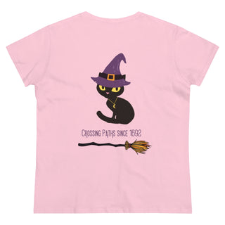 A slightly more fitted take of a classic short sleeve cotton tee. This contoured silhouette is made out of a soft, light cotton. Back side shown in Light Pink with Wide Eyed Cartoon Cat wearing Purple Hat Standing over Broom. "Crossing Paths Since 1692". On the front of shirt is similar Witchy Benefit Beagle Logo. Purrfect for Halloween, or anytime!