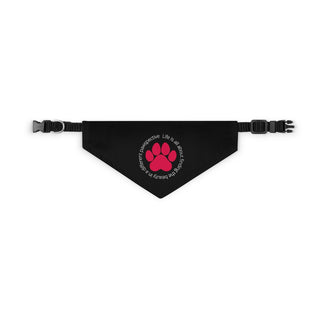 Different Pawspective Dog Collar Bandana in Black. The Different Pawspective design features the phrase "Life is all about finding the beauty in a different pawspective" around a paw print. Comes with adjustable black collar.