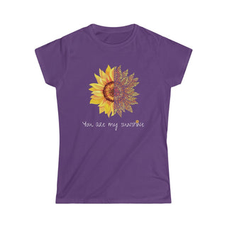 You are my Sunshine Women's Softstyle Tee in Purple. Shown is the front showcasing a sunflower which is split down the middle and half is made out of paw prints. Underneath is the phrase "You are my Sunshine" . Back of shirt features the Sunflower Benefit Beagle Logo.