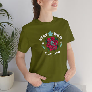 Stay Wild Unisex Premium Tee in Olive. Shown is front of Stay Wild Design features a tattoo style rose with the phrase "Stay Wild, Play Hard" around it. The back of shirt features the Stay Wild Benefit Beagle Logo Design.