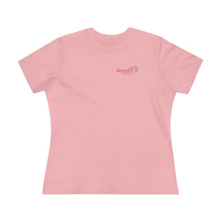 Different Pawspective Women's Premium Tee in Pink. Shown is front of shirt with Benefit Beagle logo in the top corner . On the back is large colorful pawprint with the the phrase "Life is all about finding the beauty in a different pawspective" circled around it.