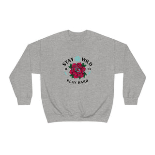 Stay Wild Unisex Heavy Blend Crewneck Sweatshirt in Sport Grey. The Stay Wild Design features a tattoo style rose with the phrase "Stay Wild, Play Hard" around it. The back of shirt features the Stay Wild Benefit Beagle Logo Design.