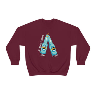 Beagle-Thirty Bottles Unisex Heavy Blend Crewneck Sweatshirt in Maroon. The front of shirt showcases Two Paw Labeled Bottles clinking with the saying, "It's Beagle-Thirty". Back of shirt features corresponding Benefit Beagle Logo.