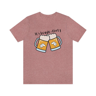 Beagle-Thirty Mugs Unisex Jersey Short Sleeve Tee in Heather Mauve. The front of shirt showcases Two Dog Adorned Mugs clinking with the saying, "It's Beagle-Thirty" above it. Back of shirt features corresponding Benefit Beagle Logo.