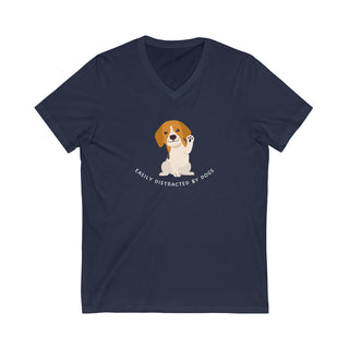 Easily Distracted Unisex Jersey Short Sleeve V-Neck Tee in Navy. Shown is front design featuring a dog waving with the saying "Easily Distracted by Dogs" below it. The back of shirt has the classic Benefit Beagle Logo.